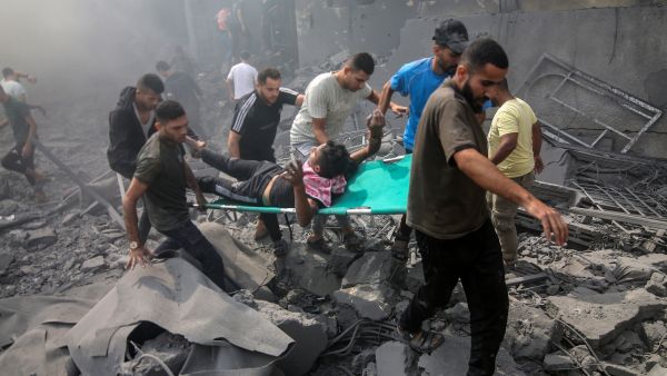 Palestinians look for survivors after an Israeli airstrike in Rafah refugee camp, southern Gaza Strip. (Anas Mohammed/ Shutterstock)