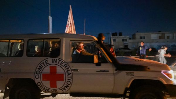 An International Red Cross vehicle carrying Israeli hostages released by Hamas crosses the Rafah border point in the Gaza Strip. (Mohammed Abed/ AFP)