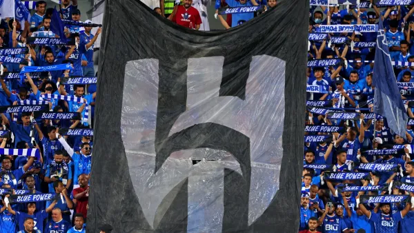 Supporters of al-Hilal cheer during the Saudi Pro League football match between Al-Hilal and Al-Shabab at Prince Faisal Bin Fahd Stadium in Riyadh on September 29, 2023. (Photo by Fayez NURELDINE / AFP)