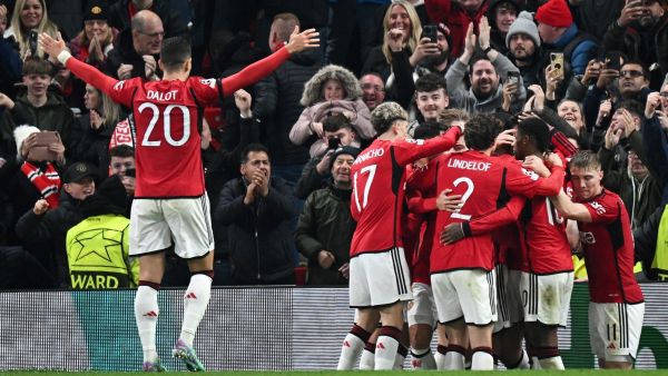 Manchester United's English defender #05 Harry Maguire (unseen) celebrates with teammates after scoring his team first goal during the UEFA Champions League Group A football match between Manchester United and FC Copenhagen at Old Trafford, in Manchester, north-west England, on October 24, 2023. (Photo by Paul ELLIS / AFP)