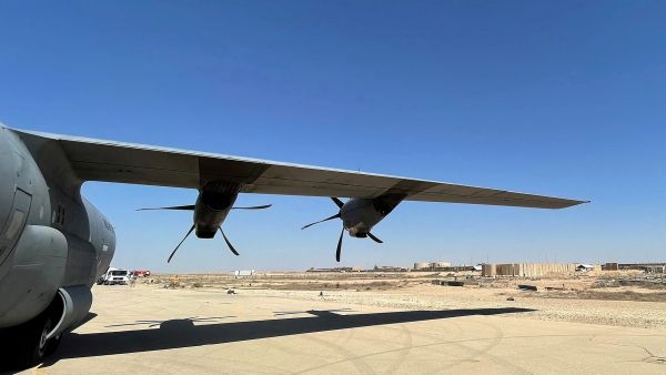 This picture taken on July 8, 2021 shows a view of the wing of a C-130 Hercules turboprop military transport aircraft on the runway at Ain al-Assad air base, which hosts US forces in Iraq in the western Anbar province, a day after fourteen rockets were fired at the base.