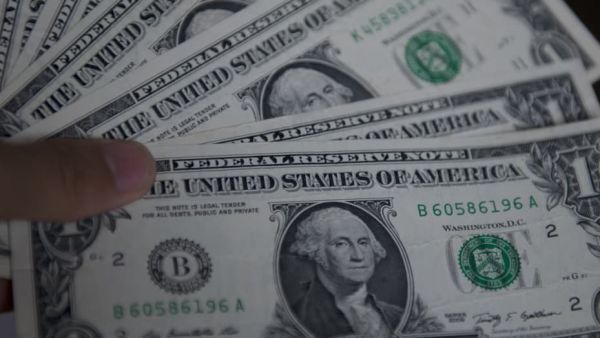 Dollar retreats as fed signals end of rate hike cycle