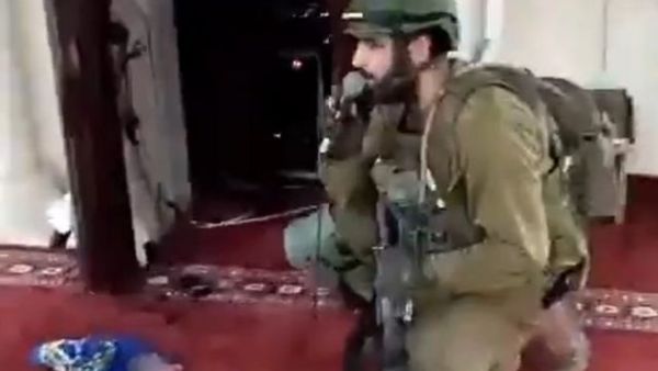 Israeli soldiers sing, dance and recite a Jewish prayer inside a mosque in West Bank. (X)