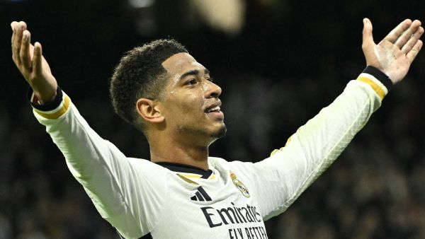 Real Madrid's English midfielder #5 Jude Bellingham celebrates scoring his team's second goal during the UEFA Champions League first round group C football match between Real Madrid CF and SSC Naples at the Santiago Bernabeu stadium in Madrid on November 29, 2023. (Photo by JAVIER SORIANO / AFP)