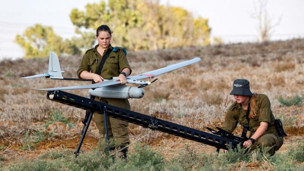 An Israeli soldier prepares an Elbit Systems Skylark I unmanned aerial vehicle (UAV or drone) for take-off near the border with the Gaza Strip in southern Israel on August 21, 2020, as part of monitoring operations in the area. / AFP