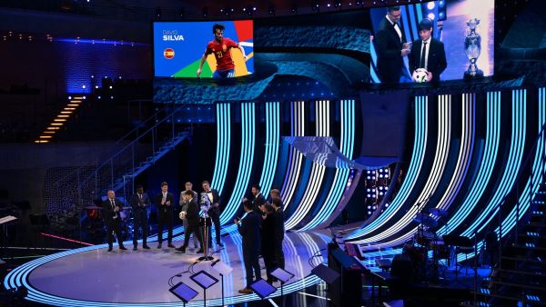 Hosts and officials stand on the stage during the final draw for the UEFA Euro 2024 European Championship football competition in Hamburg, northern Germany on December 2, 2023. (Photo by François-Xavier MARIT / AFP)