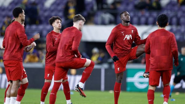 Liverpool FC's players participate in the warming session prior to the start of the UEFA Europa League football match between Union Saint Gilloise and Liverpool FC at the Lotto Park in Brussels on December 14, 2023. (Photo by KENZO TRIBOUILLARD / AFP)
