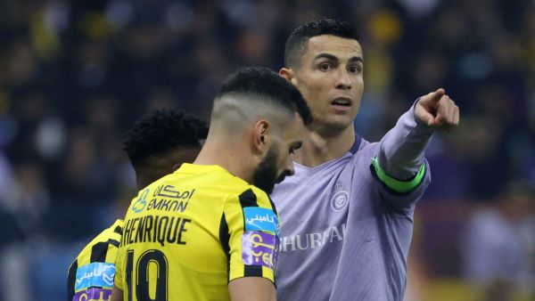 Nassr's Portuguese forward Cristiano Ronaldo (R) gestures during the Saudi Super Cup semi-final football match between Al-Ittihad and Al-Nassr at the King Fahd Stadium in Riyadh on January 26, 2023. (Photo by Fayez NURELDINE / AFP)