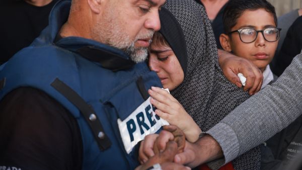 Al Jazeera journalist, Wael al-Dahdouh, escapes Gaza after losing family and colleague in Israeli strikes. (AFP)