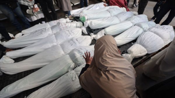 Graphic content - A mourner cries over the bodies of family members of the Nofal family, after they were killed during Israeli bombardment, on January 10, 2024 at al-Najar hospital in Rafah in the Gaza Strip. (Photo by AFP) South Africa