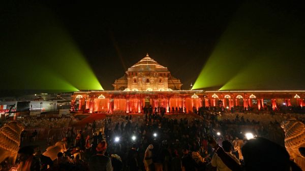 Hindu devotees gather near the illuminated Ram temple following its consecration ceremony in Ayodhya in India's Uttar Pradesh state on January 22, 2024. Prime Minister Narendra Modi said the opening of a temple on January 22, heralded a "new era" for India. AFP Hindu temple