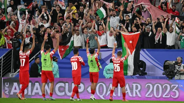 Jordan's players salute the attendance after the end of the Qatar 2023 AFC Asian Cup Group E football match between Malaysia and Jordan at the Al-Janoub Stadium in Al-Wakrah, south of Doha on January 15, 2024. (Photo by HECTOR RETAMAL / AFP)