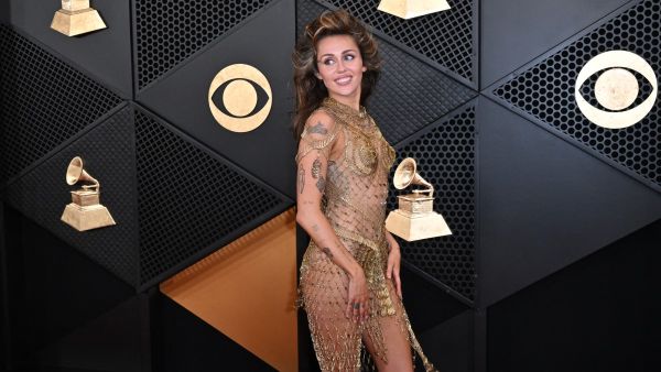 Miley Cyrus wows Grammys in nothing but gold safety pins. (Robyn Beck/AFP)