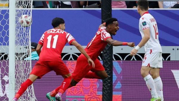 Jordan's defender #03 Abdallah Nasib celebrates scoring his team's first goal during the Qatar 2023 AFC Asian Cup quarter-final football match between Tajikistan and Jordan at the Ahmad Bin Ali Stadium in Al-Rayyan, west of Doha on February 2, 2024. (Photo by KARIM JAAFAR / AFP)