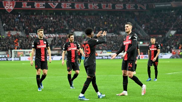Bayer Leverkusen's Czech forward #14 Patrik Schick (2nd R) and Bayer Leverkusen's English midfielder #19 Nathan Tella (C) celebrate after Molde scored a 3-0 own goal during the UEFA Europa League Group H football match between Bayer 04 Leverkusen and Molde FK in Leverkusen, on December 14, 2023. (Photo by ULRICH HUFNAGEL / AFP)