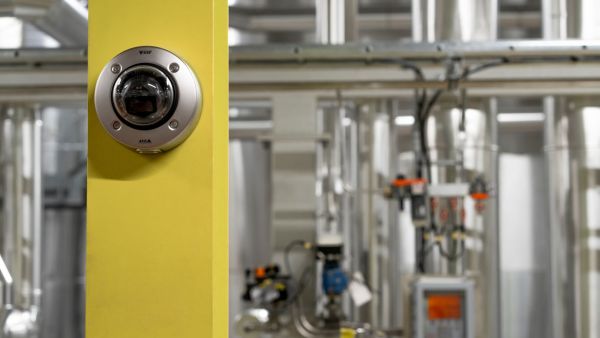 food processing plant yellow Axis Communications Introduces Stainless steel 8 MP dome for harsh environments