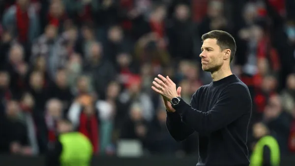 Bayer Leverkusen's Spanish head coach Xabi Alonso celebrates at the end of the UEFA Europa League Group round of 16, second-leg football match between Bayer 04 Leverkusen and Garabagh in Leverkusen, western Germany on March 14, 2024. Bayer Leverkusen won the match 3-2. (Photo by INA FASSBENDER / AFP)