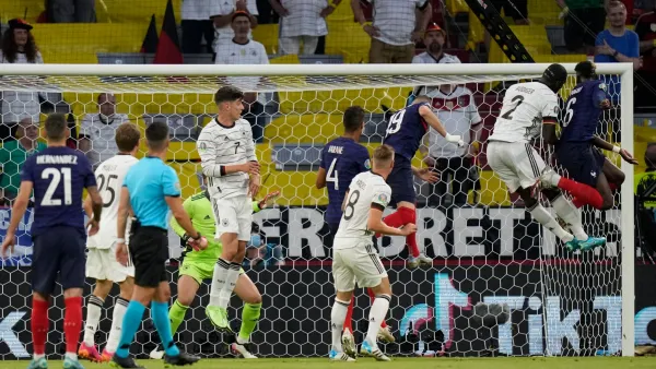 France's midfielder Paul Pogba (R) vies for the header with Germany's defender Antonio Ruediger (2nd-R) during the UEFA EURO 2020 Group F football match between France and Germany at the Allianz Arena in Munich on June 15, 2021. / AFP / POOL / Matthias Schrader