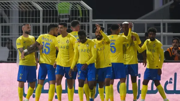 Nassr's players celebrate their team's third goal during the Saudi Pro League football match between Al-Shabab and Al-Nassr at the Al-Shabab Club Stadium in Riyadh on February 25, 2024. (Photo by Fayez NURELDINE / AFP)