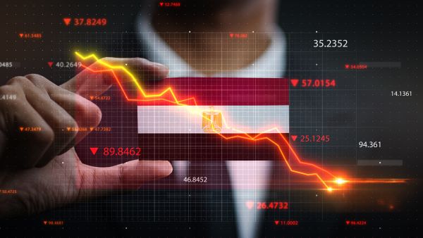 Egypt devalues its pound with record interest rate hike