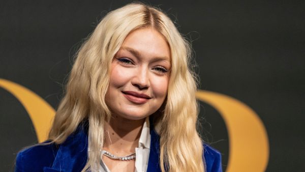Gigi Hadid plants a kiss on Bradley Cooper during PDA-packed date night in NYC