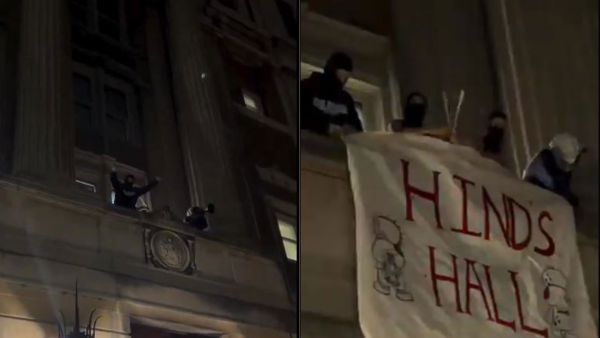 Columbia University students on the balcony of Hamilton Hall and spreading a billboard reading "Hind's Hall" along with Hadala characters. 
