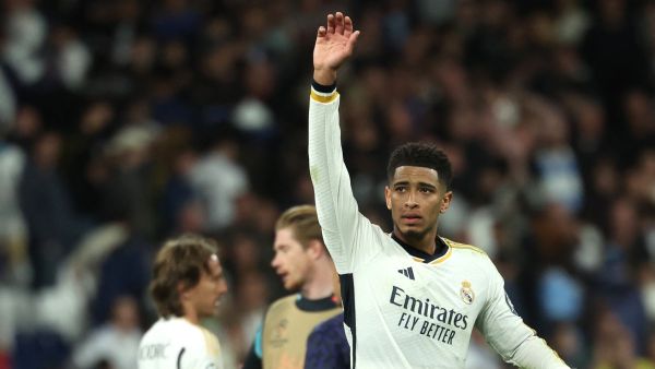 Real Madrid's English midfielder #5 Jude Bellingham reacts at the end of the UEFA Champions League quarter final first leg football match between Real Madrid CF and Manchester City at the Santiago Bernabeu stadium in Madrid on April 9, 2024. (Photo by Pierre-Philippe MARCOU / AFP)