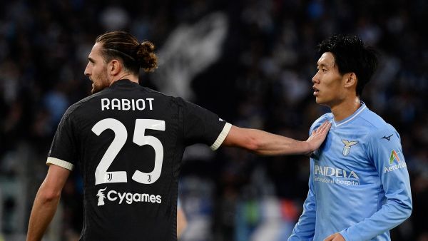 Juventus' French midfielder #25 Adrien Rabiot pushes Lazio's Japanese midfielder #06 Daichi Kamada during the Italian Serie A football match between Lazio and Juventus at the Olympic stadium in Rome, on March 30, 2024. (Photo by Filippo MONTEFORTE / AFP)