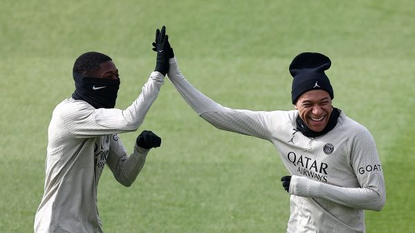 Paris Saint-Germain's French forward #10 Ousmane Dembele (L) reacts with Paris Saint-Germain's French forward #07 Kylian Mbappe during a training session in Poissy, west of Paris, on April 9, 2024, on the eve of their UEFA champions league quarter-final first leg football match against Barcelona. (Photo by FRANCK FIFE / AFP)