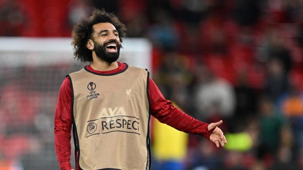 Liverpool's Egyptian striker #11 Mohamed Salah smiles as he warms up ahead of the UEFA Europa League group E football match between Liverpool and Royale Union Saint-Gilloise at Anfield in Liverpool, north west England on October 5, 2023. (Photo by Oli SCARFF / AFP)