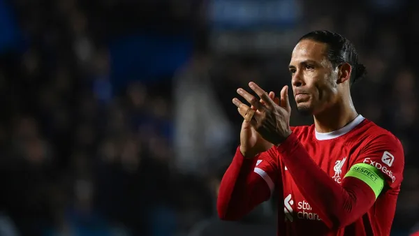 Liverpool's Dutch defender #4 Virgil van Dijk acknowledges the fans after the team lost in the UEFA Europa League quarter-final second leg football match between Atalanta BC and Liverpool FC at the Atleti Azzurri d'Italia Stadium in Bergamo, on April 18, 2024. Liverpool were knocked out of the Europa League by Atalanta with the Italian side reaching the semi-finals 3-1 on aggregate on April 18, 2024. (Photo by Isabella BONOTTO / AFP)