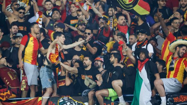 Esperance supporters sing during the CAF Champions League second-leg semifinal football match between South Africa’s Mamelodi Sundowns and Tunisia's Esperance Sportive de Tunis at Loftus Versfeld Stadium in Pretoria on April 26, 2024. (Photo by Phill Magakoe / AFP)