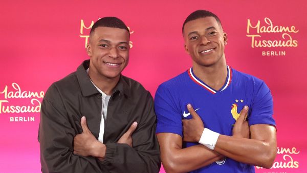 Paris Saint-Germain's French forward #07 Kylian Mbappe poses as he unveils his one-of-a-kind wax figure in Paris on May 16, 2024. Mbappe's one-of-a-kind wax figure will be taken to Berlin to be exhibited at Madame Tussauds in Berlin. (Photo by FRANCK FIFE / AFP)