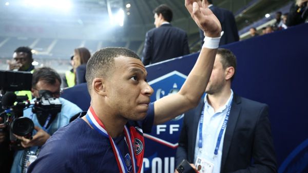 Paris Saint-Germain's French forward #07 Kylian Mbappe waves goodbye to PSG supporters after playing his final match for Paris Saint-Germain (PSG) at the end of the French Cup Final football match against Olympique Lyonnais (OL) at the Stade Pierre-Mauroy, in Villeneuve-d'Ascq, northern France on May 25, 2024. The game was the club's top scorer's 308th and final appearance for his hometown club, for whom he signed in August 2017 from Monaco in a 180 million-euro deal. (Photo by FRANCK FIFE / AFP)