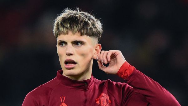 Manchester United's Argentinian midfielder #17 Alejandro Garnacho warms up prior to the UEFA Champions League group A football match between Manchester United and FC Bayern Munich at Old Trafford stadium in Manchester, north west England, on December 12, 2023. (Photo by PETER POWELL / AFP)