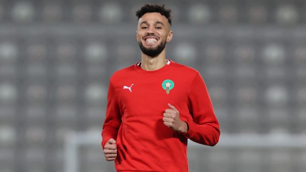 Morocco's defender #03 Noussair Mazraoui smiles during a training session at the Al Duhail SC Stadium in Doha on December 9, 2022, on the eve of the Qatar 2022 World Cup quarter-final football match between Morocco and Portugal. (Photo by KARIM JAAFAR / AFP)