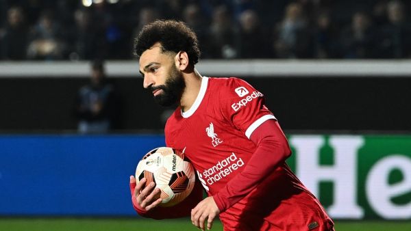 Liverpool's Egyptian forward #11 Mohamed Salah celebrates after scoring a penalty during the UEFA Europa League quarter-final second leg football match between Atalanta BC and Liverpool FC at the Atleti Azzurri d'Italia Stadium in Bergamo, on April 18, 2024. (Photo by Isabella BONOTTO / AFP)