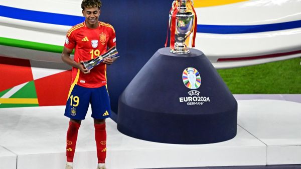 Spain's forward #19 Lamine Yamal celebrates winning the young player of the tournament award after the UEFA Euro 2024 final football match between Spain and England at the Olympiastadion in Berlin on July 14, 2024. (Photo by Tobias SCHWARZ / AFP)