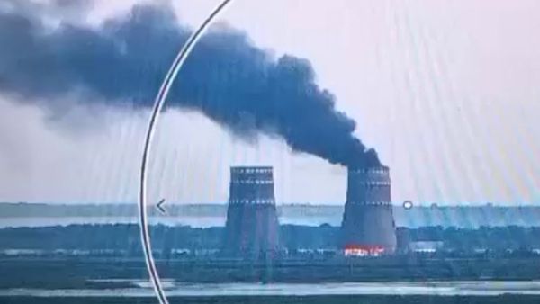 This video grab taken from a handout footage released by the Ukrainian Presidential Press Service on August 11, 2024, shows a fire at a cooling tower of the Russian-controlled Zaporizhzhia nuclear power plant in Energodar, Southern Ukraine. (Photo by Handout / UKRAINIAN PRESIDENTIAL PRESS SERVICE / AFP)  Zaporizhzhia Nuclear power plant