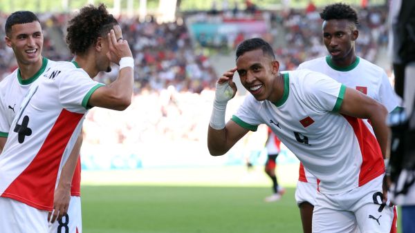 Morocco's forward #09 Soufiane Rahimi (2R) celebrates scoring the opening goal in the men's bronze medal football match between Egypt and Morocco during the Paris 2024 Olympic Games at the La Beaujoire Stadium in Nantes on August 8, 2024. (Photo by ALAIN JOCARD / AFP)