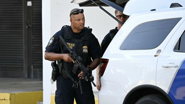 US Department of Homeland Security police officers stand outside the Paul G. Rogers Federal Building and US Courthouse