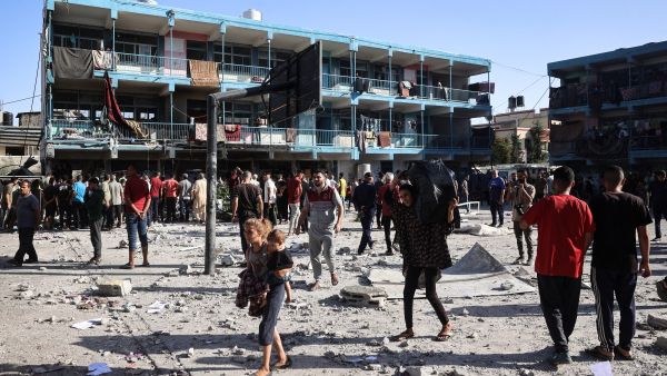 Palestinians walk in the courtyard of a school after an Israeli air strike hit the site, in Nuseirat in the central Gaza Strip on September 11, 2024, amid the ongoing war in the Palestinian territory between Israeli occupation forces and Hamas. AFP Israeli massacre on a UN run school in Gaza