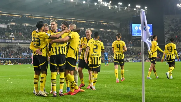 Dortmund´s players celebrate after winning the UEFA Champions League's 1st round day 1 football match between Club Brugge KV and Borussia Dortmund at the Jan Breydel Stadium in Bruges on September 18, 2024. (Photo by NICOLAS TUCAT / AFP)