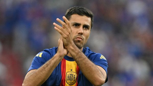 Spain's midfielder #16 Rodri greets fans during warm ups ahead of the UEFA Euro 2024 semi-final football match between Spain and France at the Munich Football Arena in Munich on July 9, 2024. (Photo by MIGUEL MEDINA / AFP)