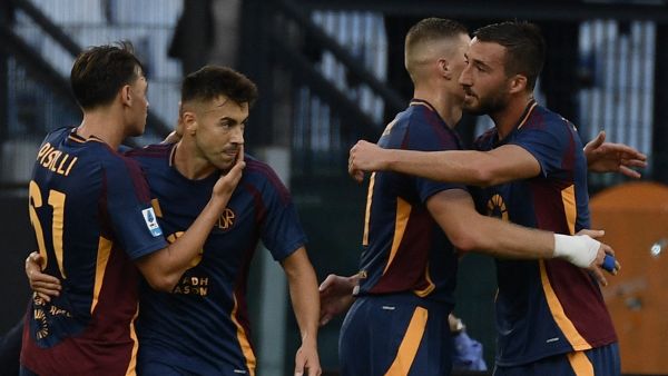 Roma's Ukrainian forward #11 Artem Dovbyk (2ndR) celebrates with teammates Roma's Italian midfielder #04 Bryan Christante, Roma's Italian forward #92 Stephan El Shaarawy and Roma's Italian midfielder #61 Niccolo Pisilli after scoring his team first goal during the Italian Serie A football match between AS Roma and Udinese at the Olympic stadium in Rome on September 22, 2024. (Photo by Filippo MONTEFORTE / AFP)