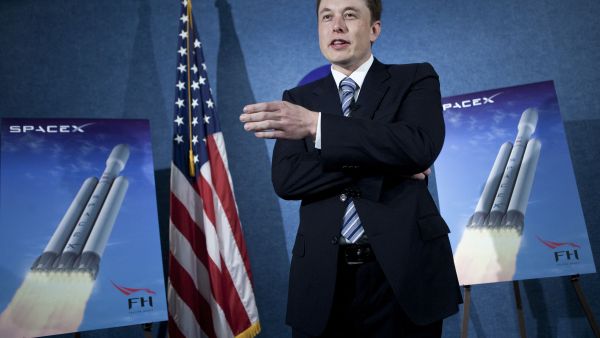 Elon Musk, CEO of SpaceX and Tesla, speaks during a news conference at the National Press Club April 5, 2011 in Washington, DC. (Photo by BRENDAN SMIALOWSKI / GETTY IMAGES NORTH AMERICA / Getty Images via AFP) Biden slams Elon Musk for working illegally in the US