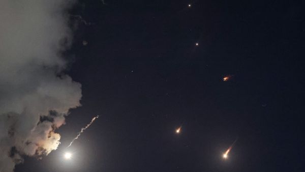 Iran launches dozens of missiles, sirens sound across Israel