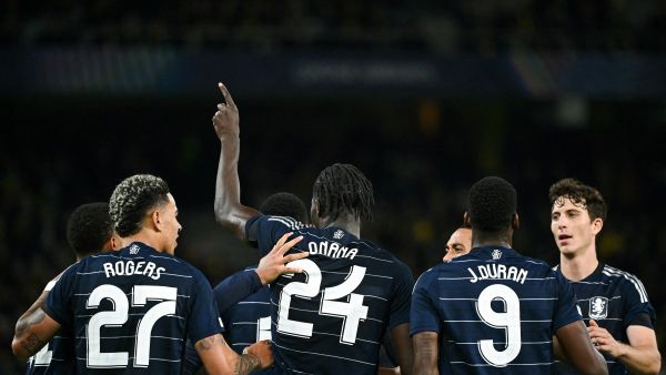 Aston Villa's Belgian midfielder #24 Amadou Onana celebrates with teammates after scoring his team's third goal during the UEFA Champions League 1st round day 1 football match between Young Boys and Aston Villa, at the Wankdorf Stadium in Bern, on September 17, 2024. (Photo by SEBASTIEN BOZON / AFP)
