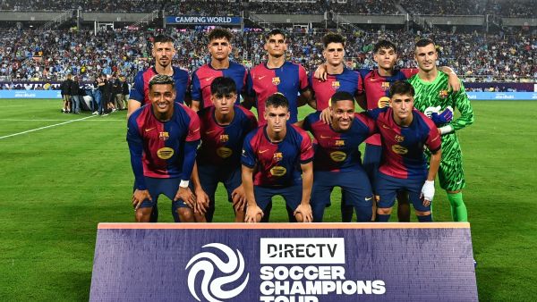 FC Barcelona players pose for a team photo before the start of a 2024 FC Series pre-season friendly football match between FC Barcelona and Manchester City at Camping World Stadium in Orlando, Florida, on July 30, 2024. (Photo by CHANDAN KHANNA / AFP)