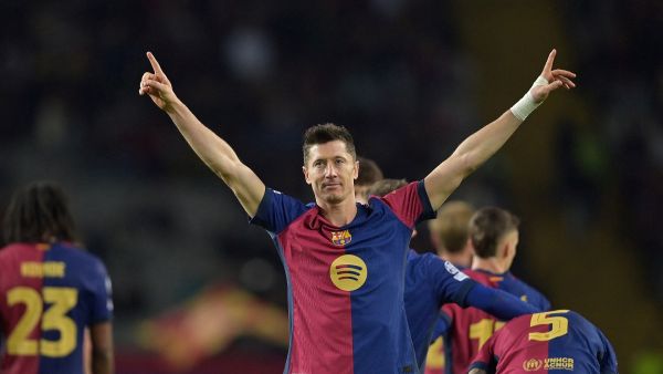 Barcelona's Polish forward #09 Robert Lewandowski celebrates scoring his team's third goal during the UEFA Champions League, league phase day 5 football match between FC Barcelona and Stade Brestois 29 (Brest) at the Estadi Olimpic Lluis Companys in Barcelona, on November 26, 2024. (Photo by MANAURE QUINTERO / AFP)